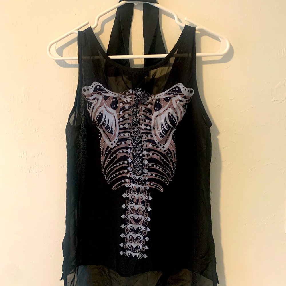 Black collared shirt w skeleton spine on back